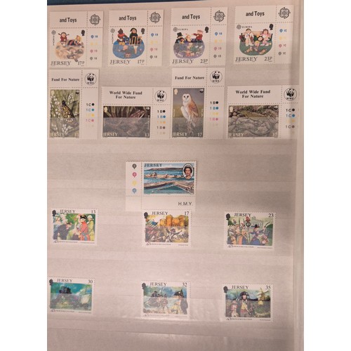 227 - Tray of seven stamp albums containing Jersey stamps.