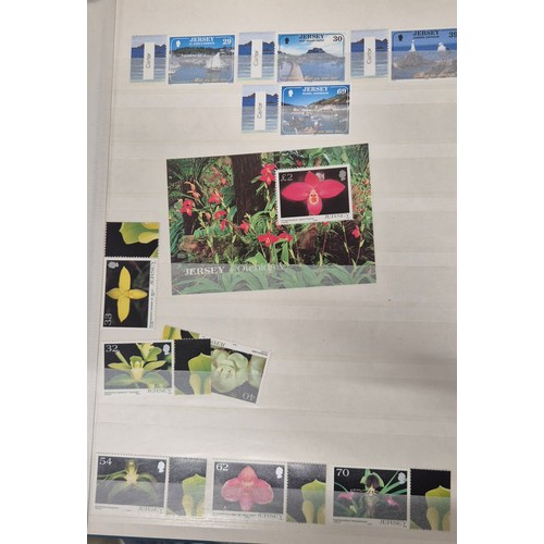 227 - Tray of seven stamp albums containing Jersey stamps.