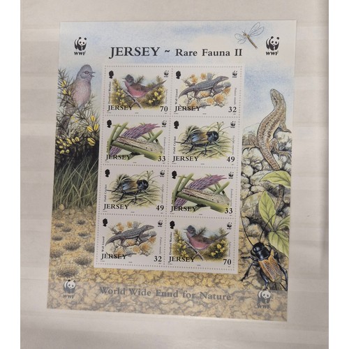 227 - Tray of seven stamp albums containing Jersey stamps.