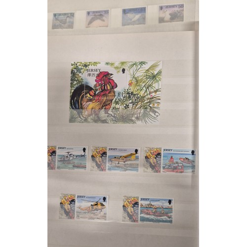 227 - Tray of seven stamp albums containing Jersey stamps.