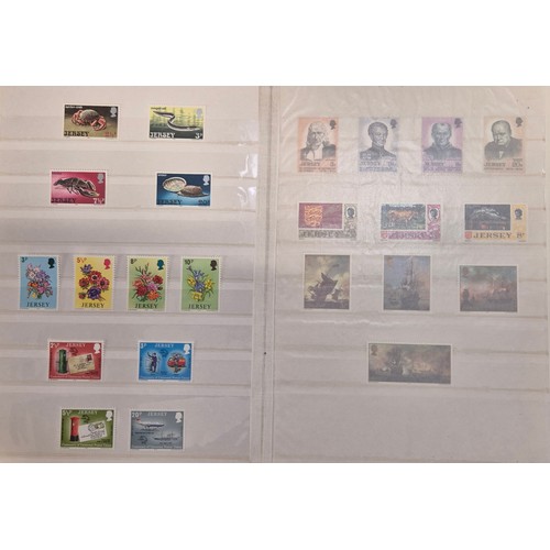 227 - Tray of seven stamp albums containing Jersey stamps.