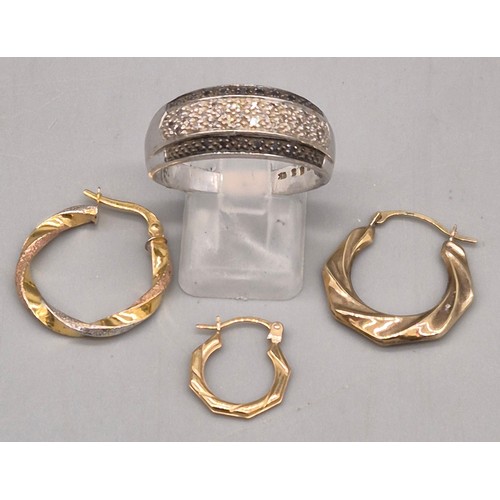 23 - 9ct white gold and diamond stone ring. Fitted with black and white diamonds. Three 9ct yellow gold h... 