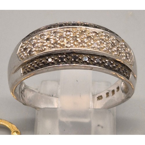 23 - 9ct white gold and diamond stone ring. Fitted with black and white diamonds. Three 9ct yellow gold h... 