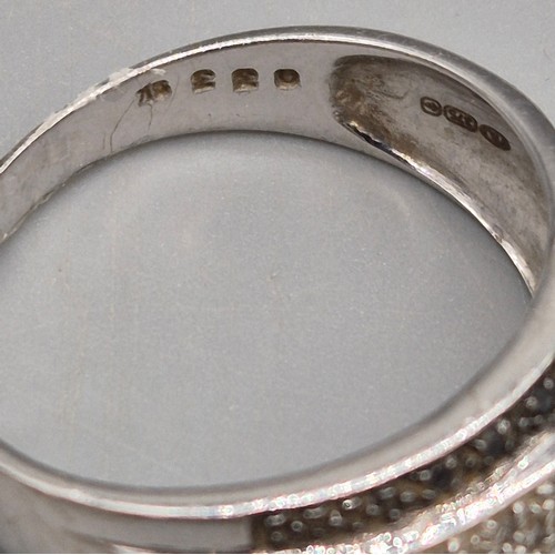 23 - 9ct white gold and diamond stone ring. Fitted with black and white diamonds. Three 9ct yellow gold h... 