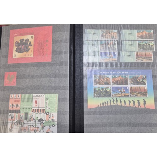 227 - Tray of seven stamp albums containing Jersey stamps.