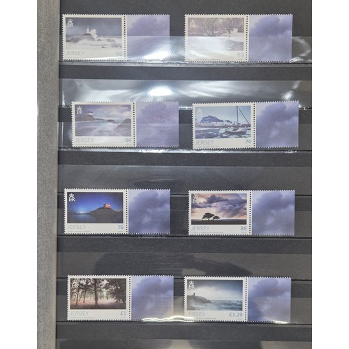 227 - Tray of seven stamp albums containing Jersey stamps.