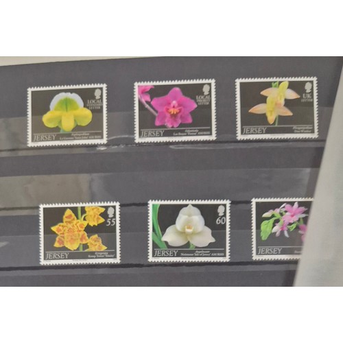 227 - Tray of seven stamp albums containing Jersey stamps.