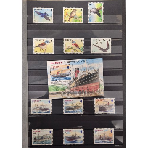 227 - Tray of seven stamp albums containing Jersey stamps.