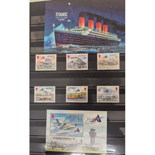 227 - Tray of seven stamp albums containing Jersey stamps.