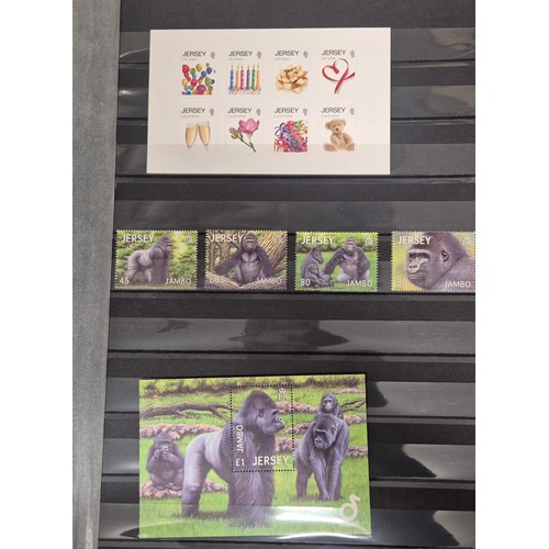 227 - Tray of seven stamp albums containing Jersey stamps.