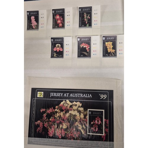 227 - Tray of seven stamp albums containing Jersey stamps.