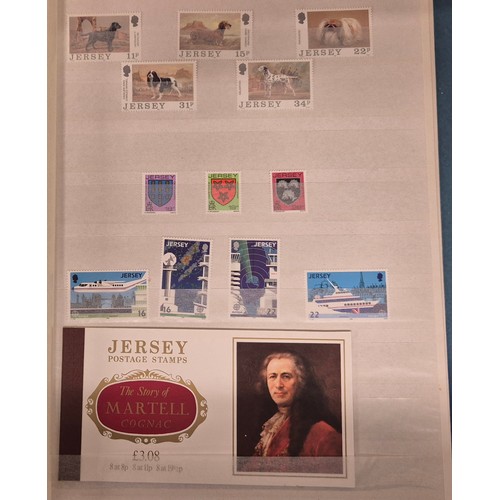 227 - Tray of seven stamp albums containing Jersey stamps.