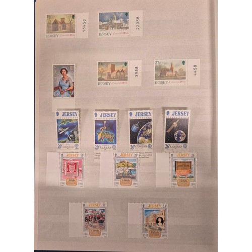 227 - Tray of seven stamp albums containing Jersey stamps.