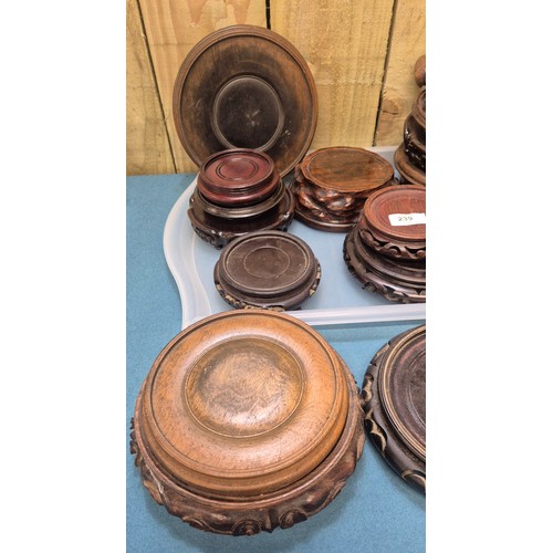 239 - Two trays of 19th and 20th century Chinese carved wooden stands.