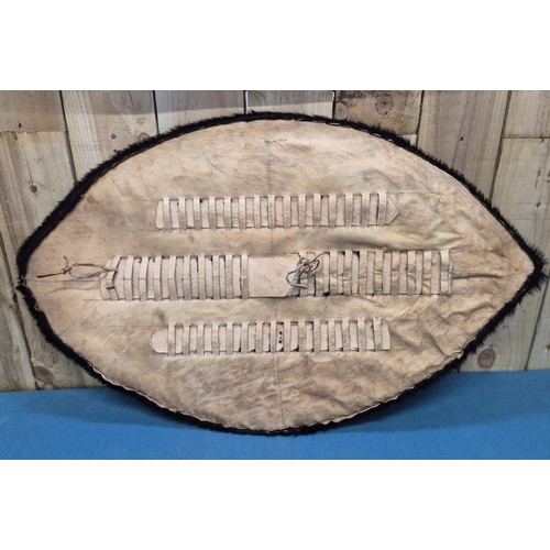 243 - Selection of African carved items; four African hand carved walking sticks, Zulu style shield and ca... 