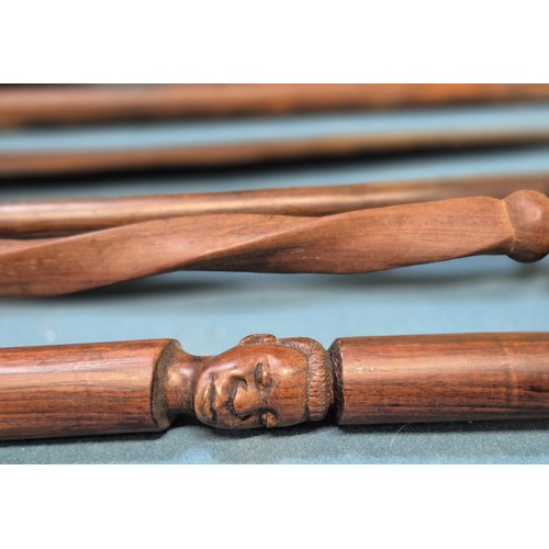 243 - Selection of African carved items; four African hand carved walking sticks, Zulu style shield and ca... 