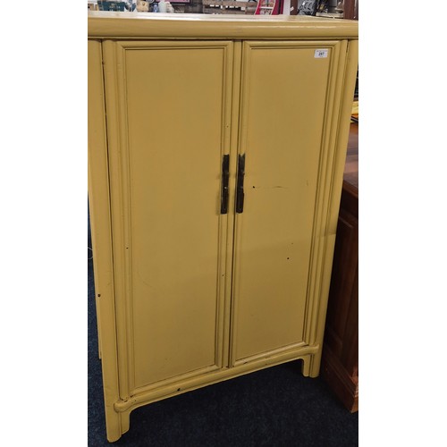 287 - 19th Century Chinese Two door cabinet painted in a Mustard colour. 123.5x71x34cm