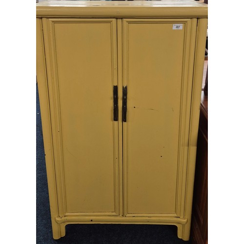 287 - 19th Century Chinese Two door cabinet painted in a Mustard colour. 123.5x71x34cm