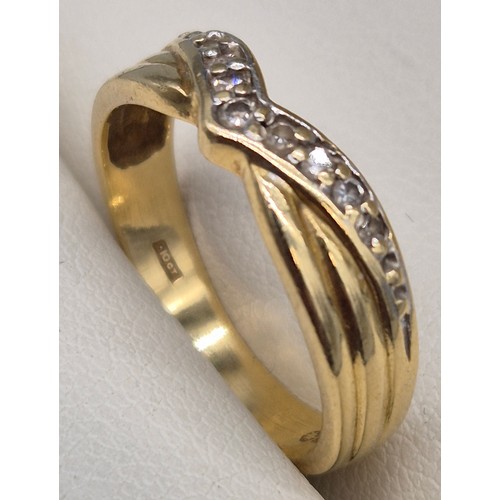 28 - 18ct yellow gold and diamond stone wish bone ring. 3.11Grams. Ring size L.