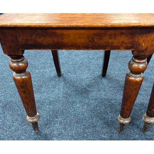 354 - John Taylor of Edinburgh
Two Victorian hall chairs with shield back and raised on turned legs. 91cm ... 