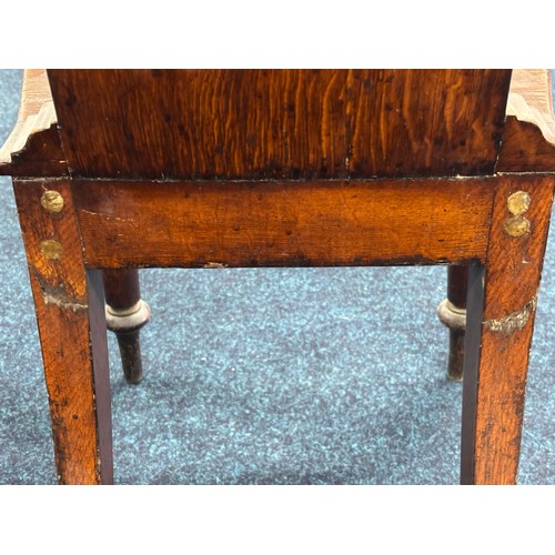 354 - John Taylor of Edinburgh
Two Victorian hall chairs with shield back and raised on turned legs. 91cm ... 