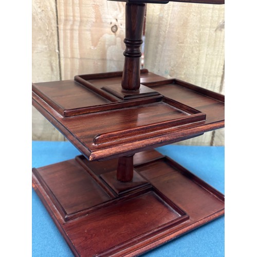 353 - Chinese mahogany revolving small display stand. 30cm x 23cm x 23xm.