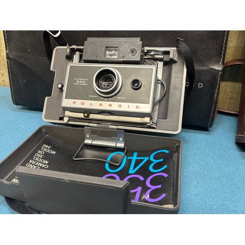 370 - Two polaroid camera's; Polaroid SX-70 Camera, accessories and travel bag and one other.