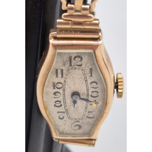 60 - 9ct yellow gold art deco design watch. Fitted with a rolled gold bracelet strap. Non runner.