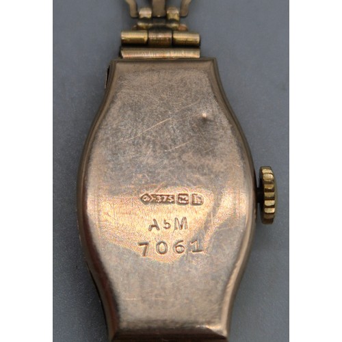 60 - 9ct yellow gold art deco design watch. Fitted with a rolled gold bracelet strap. Non runner.