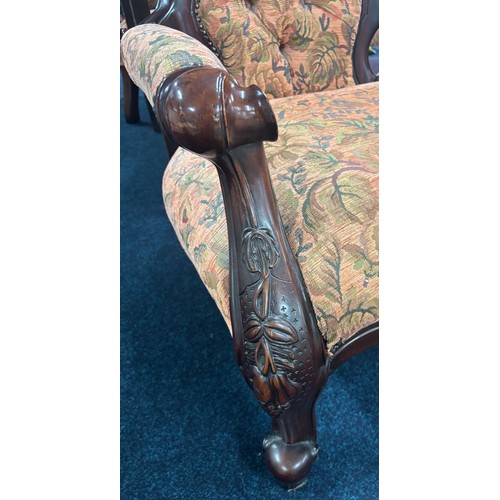 437 - Reproduction of a 19th century parlour arm chair. Button back. Dark wood frame and floral material.