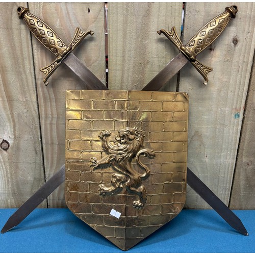 463 - Indian Sabre and scabbard. Together with two wall hanging shield and sword plaques.