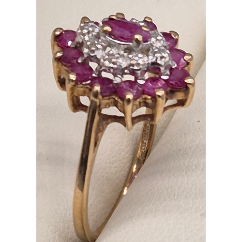 84 - 9ct yellow gold, ruby and diamond cluster ring. 2.40Grams. Ring size N 1/2.