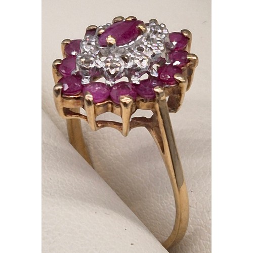 84 - 9ct yellow gold, ruby and diamond cluster ring. 2.40Grams. Ring size N 1/2.