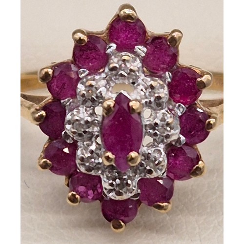 84 - 9ct yellow gold, ruby and diamond cluster ring. 2.40Grams. Ring size N 1/2.
