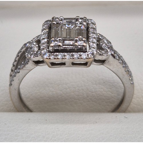 114A - 18ct white gold and diamond ring. 0.60cts. Round and emerald cut diamonds. Missing one round cut dia... 