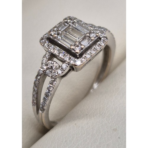 114A - 18ct white gold and diamond ring. 0.60cts. Round and emerald cut diamonds. Missing one round cut dia... 
