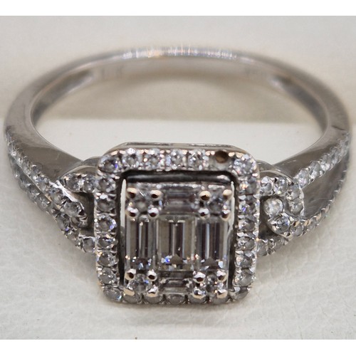 114A - 18ct white gold and diamond ring. 0.60cts. Round and emerald cut diamonds. Missing one round cut dia... 