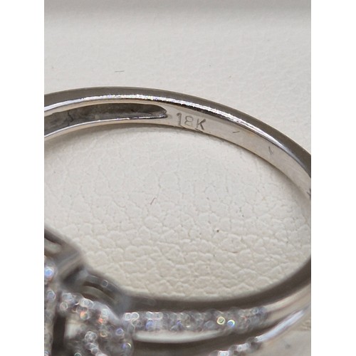 114A - 18ct white gold and diamond ring. 0.60cts. Round and emerald cut diamonds. Missing one round cut dia... 