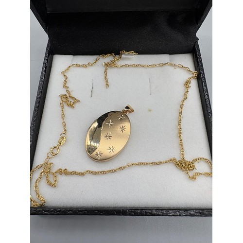 113A - 925 silver gilt locket together with a 9ct scrap gold chain. 1.33grams.