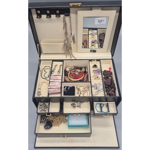 127A - Jewellery box containing a collection of costume jewellery rings, brooches and necklaces.
