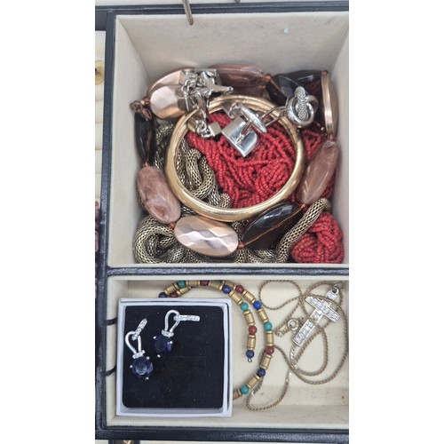 127A - Jewellery box containing a collection of costume jewellery rings, brooches and necklaces.