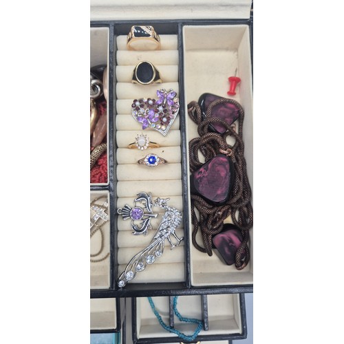 127A - Jewellery box containing a collection of costume jewellery rings, brooches and necklaces.