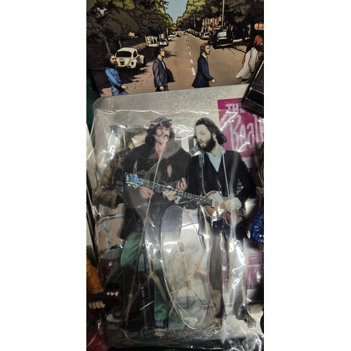 144 - Collection of Beatles Memorabilia items; The Beatles Character figures, Beatle DVD set collectable b... 