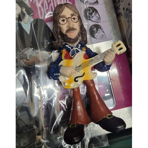 144 - Collection of Beatles Memorabilia items; The Beatles Character figures, Beatle DVD set collectable b... 