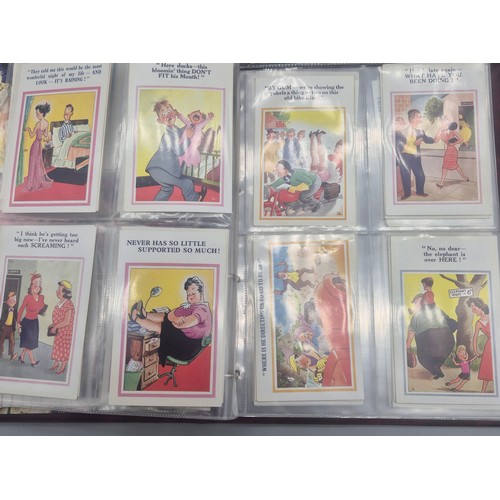 147 - Three albums of antique Comical Postcards.