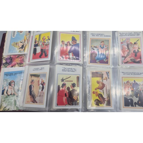 147 - Three albums of antique Comical Postcards.