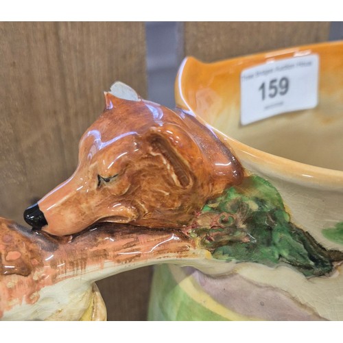 159 - Collection of Three Royal Doulton items; Dye Ken John Peele porcelain jug, Paddy Toby jug & Simon Ce... 