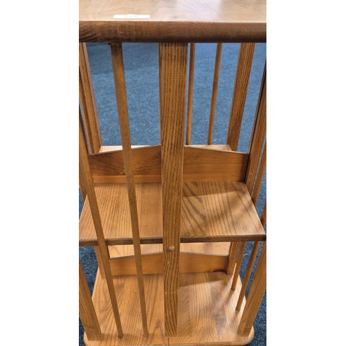 188 - Light Oak Ercol Style Revolving Book Case. H75.5xL45xW44.5