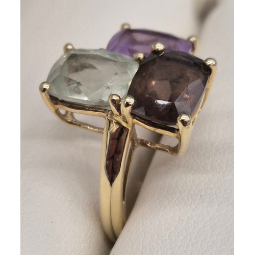 29 - 9ct yellow gold ladies ring fitted with three gem stones, Amethyst and quartz. 4.04Grams. Ring size ... 