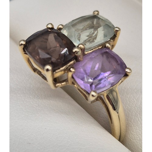 29 - 9ct yellow gold ladies ring fitted with three gem stones, Amethyst and quartz. 4.04Grams. Ring size ... 